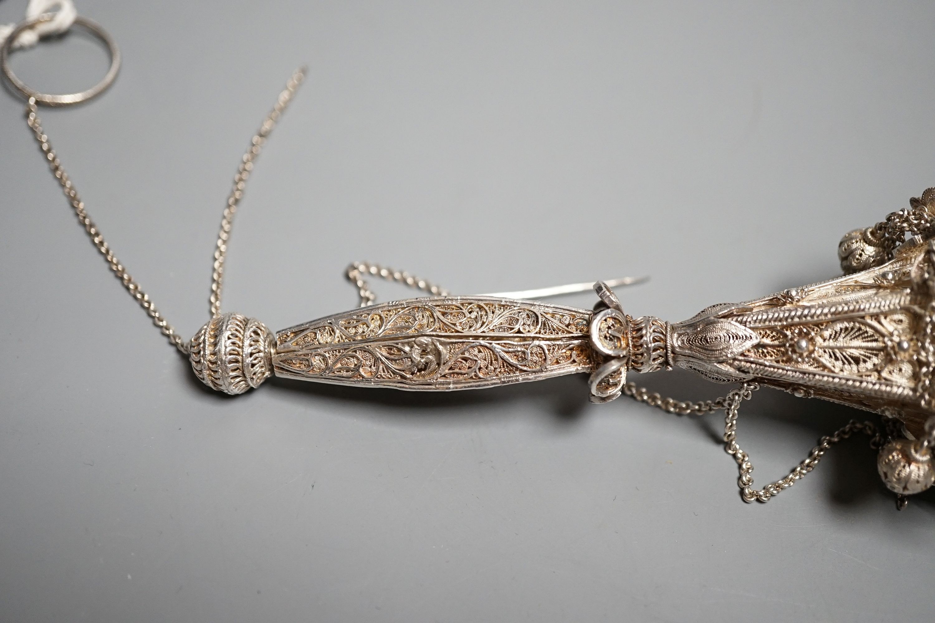 A late 19th century white metal filigree posy holder, 14.1cm. The ball at the base unscrewing to reveal three spring-loaded legs